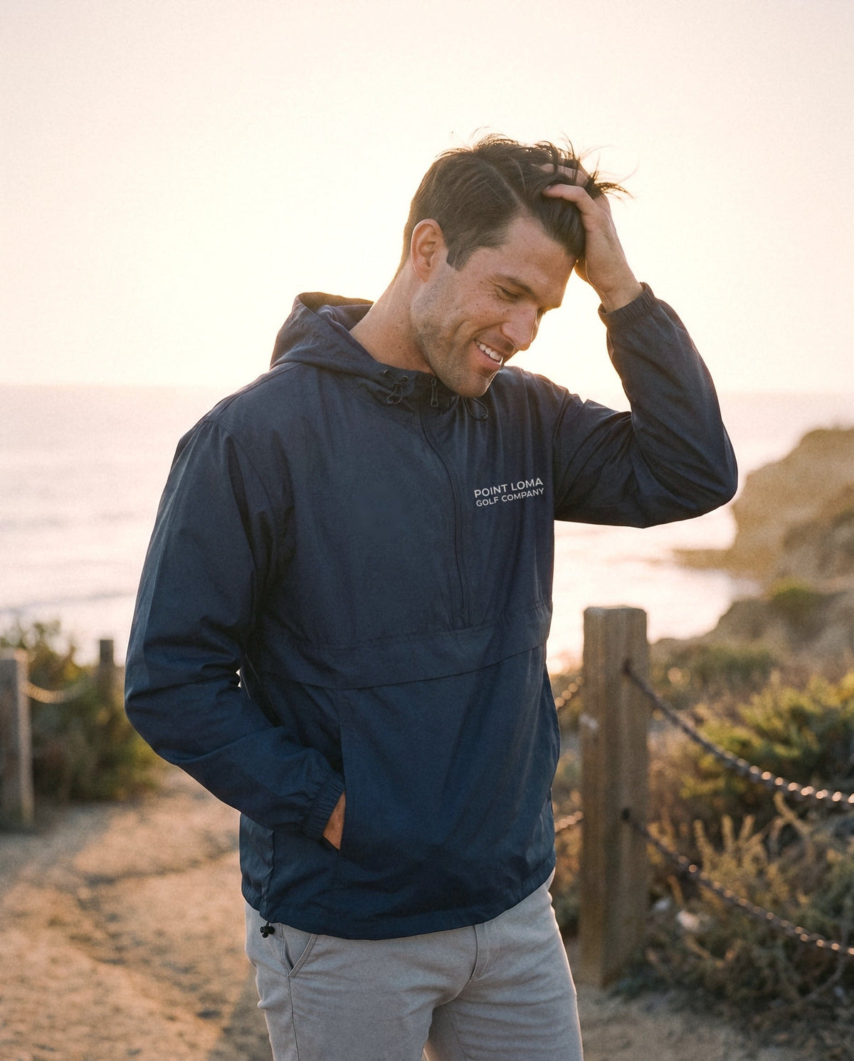 Navy windbreaker on the Sunset Cliffs trail at sunset