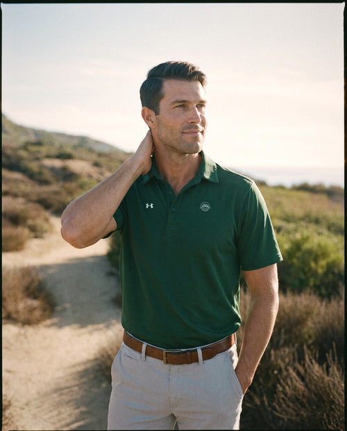 Forest green polo on the Cabrillo trail, emblem on the left chest