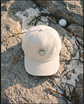 Ivory rope cap with the embroidered emblem