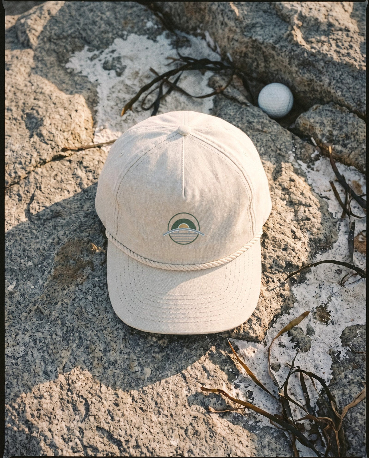 Ivory rope cap with the embroidered emblem