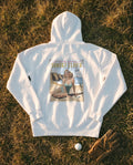 White Flyover Hoodie flat lay, Sunset Cliffs sunset sign on the back