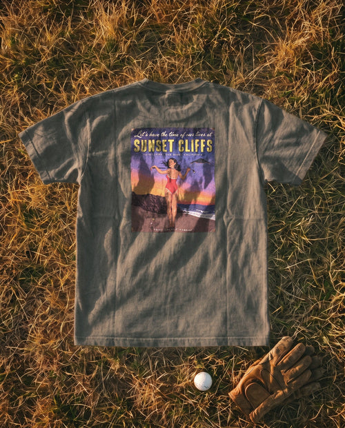 Pepper Flyover Tee flat lay, Sunset Cliffs dusk sign on the back