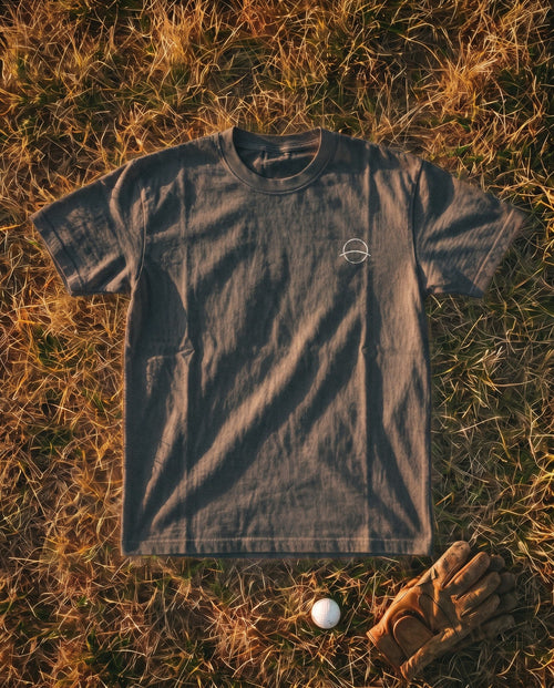 Pepper Flyover Tee flat lay, mono mark on the left chest